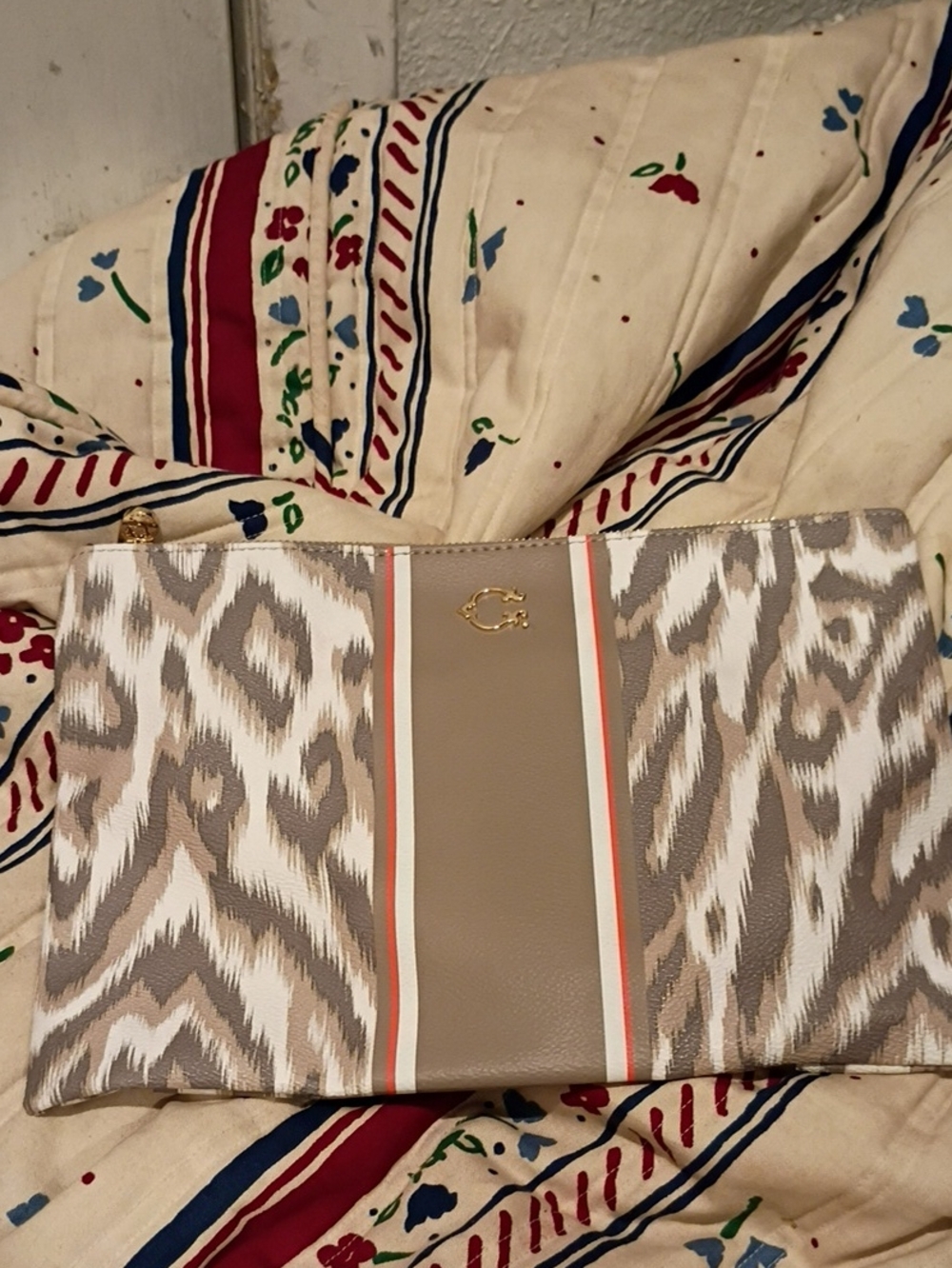 Neutral Patterned Wristlet Clutch with Gold Emblem